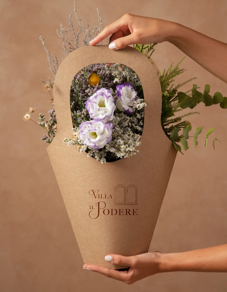 Hands holding beautiful flowers basket